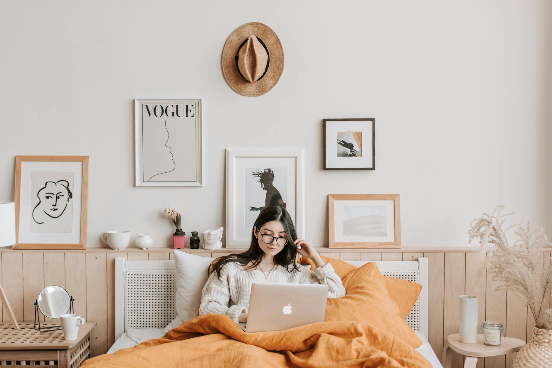 woman using laptop in bed